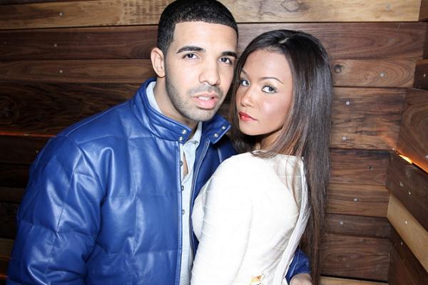 Dollicia Bryan and Drake posing for a photograph 