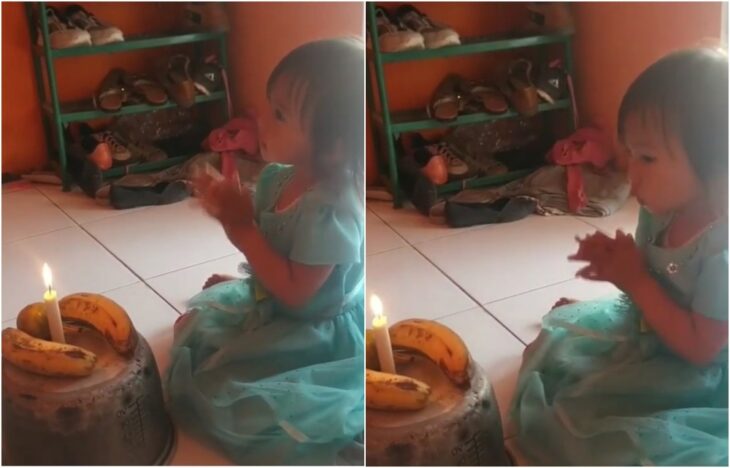 Niña aplaudiendo; Sus papás no tenían para el pastel; fue la más feliz soplando la vela a tres plátanos