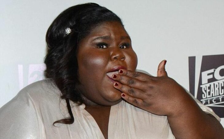 Gabourey Sidibe posing for a photo on a red carpet 