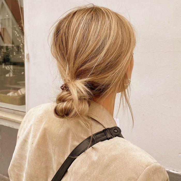 long-haired girl with an easy hairstyle, collected, bun, braids, blonde hair, brown, dark, light, with loose strands