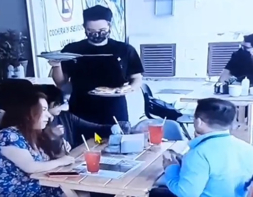 Family putting hair in restaurant food 