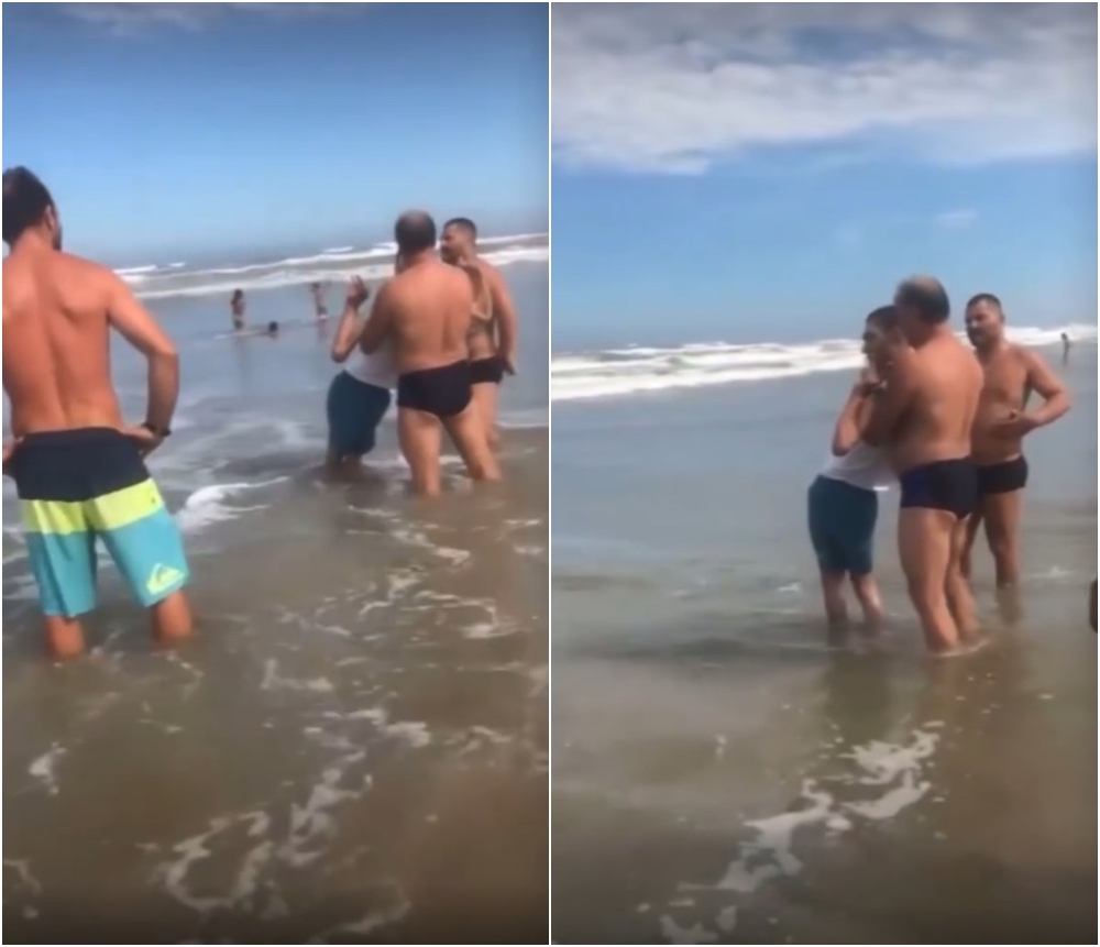 Hombres cargando a un chico; Hombres ayudaron a un papá para que su hijo con discapacidad se bañara en el mar