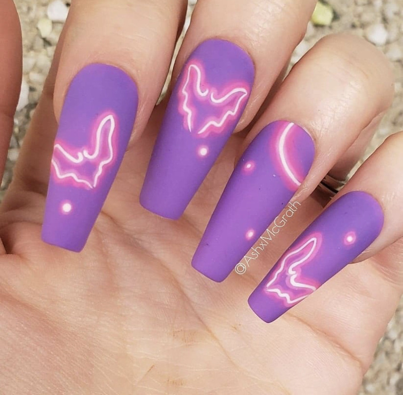 Manicure with bats in neon tone;  18 Manicures Your Inner Witch Won't Resist