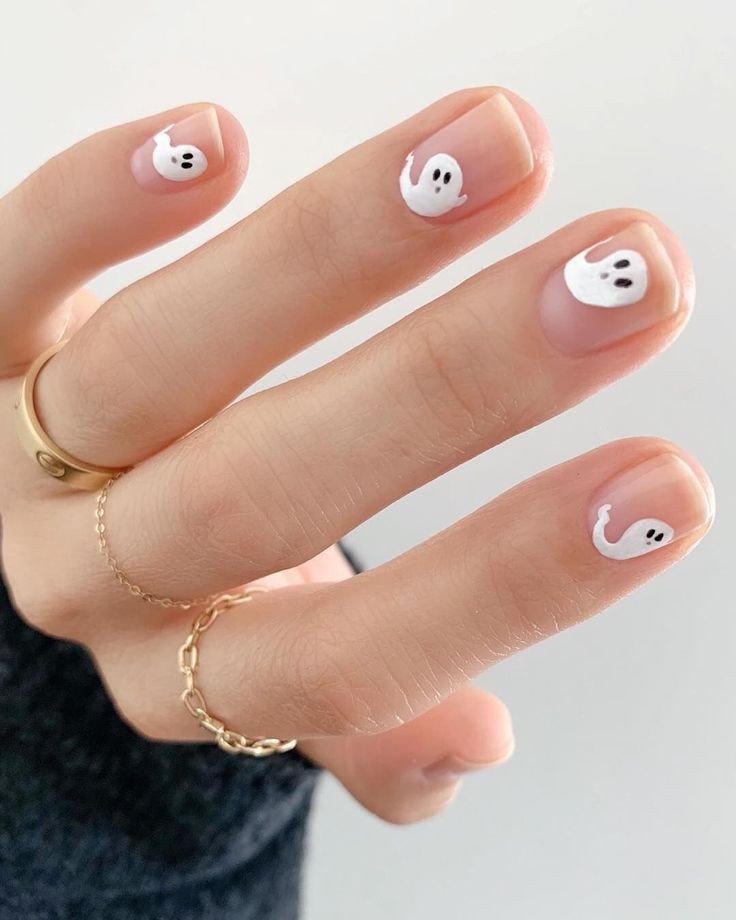 Manicure with small ghosts;  18 Manicures Your Inner Witch Won't Resist