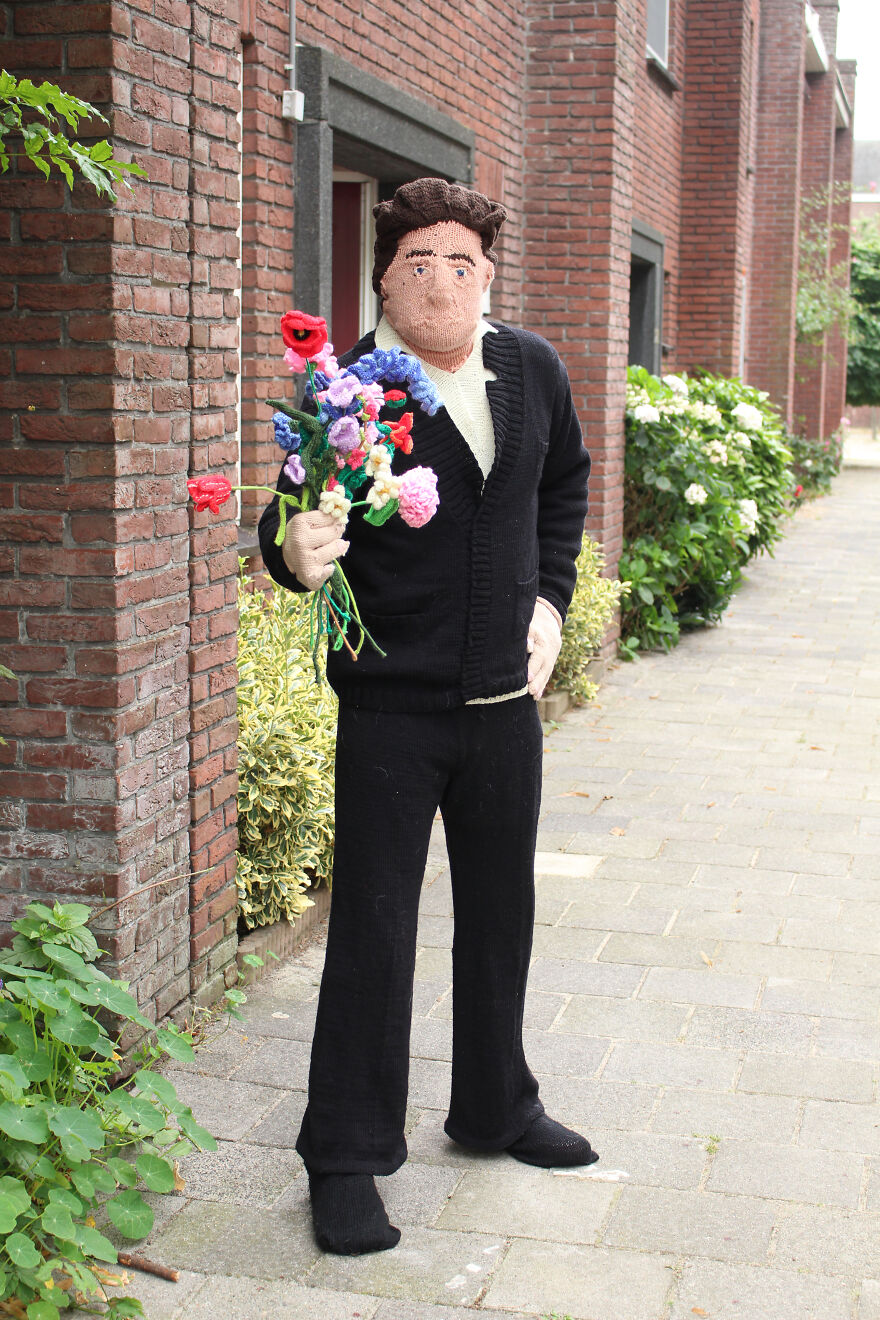 Woven doll with flowers in hand;  Woman weaves her husband and son in life size