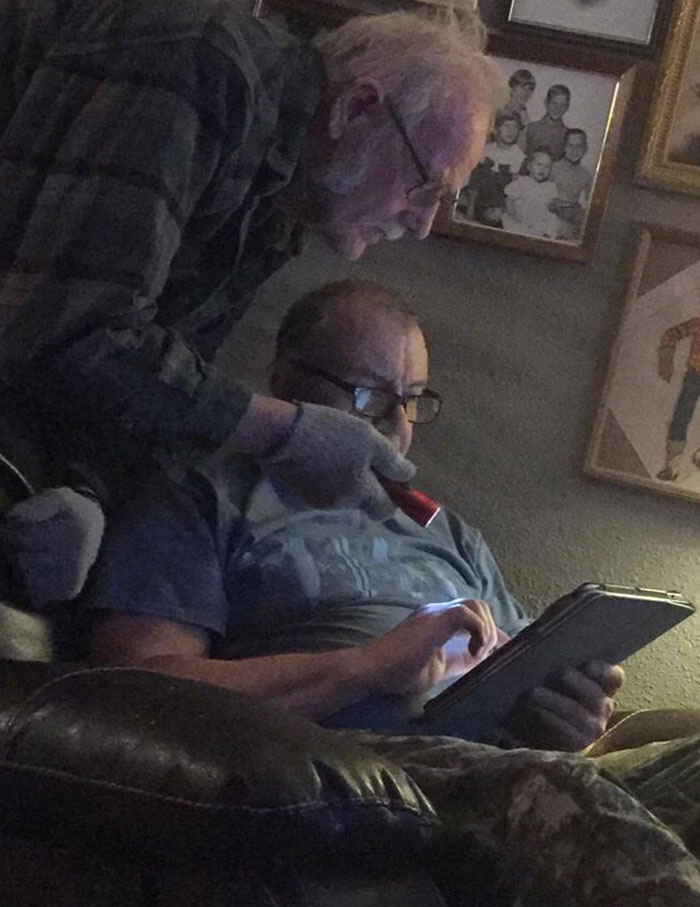 Men lighting up a screen;  17 grandparents who had fun problems with technology