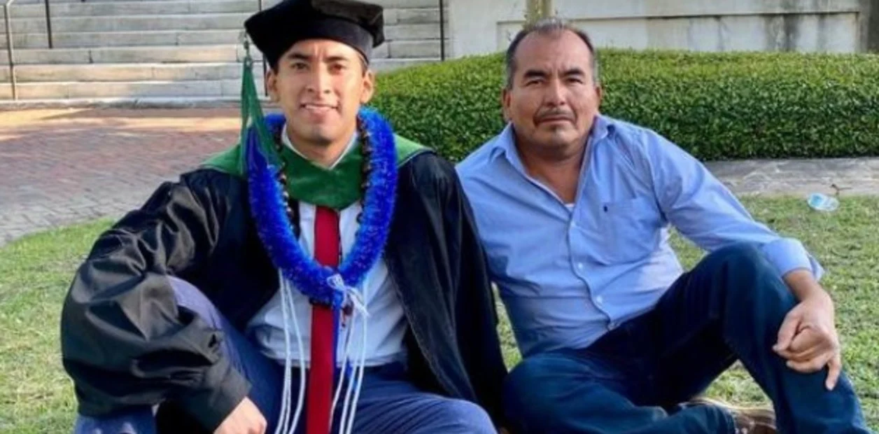 Father and son at a graduation;  son of peasants manages to graduate from Harvard