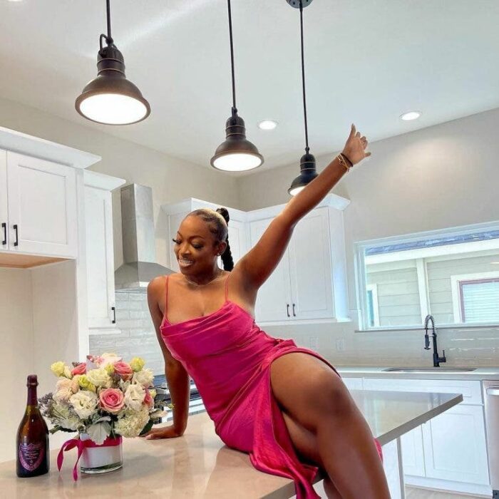 Girl sitting on kitchen counter 