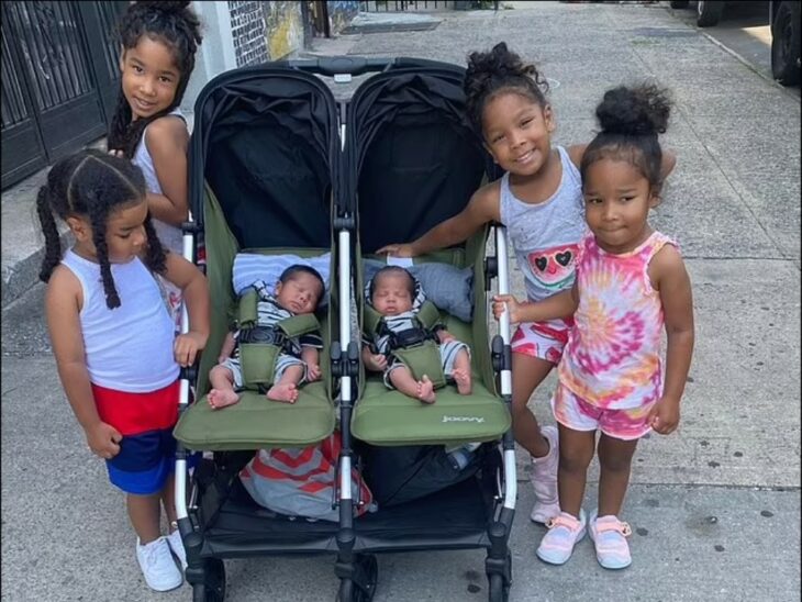 Three pairs of twins strolling down the street 