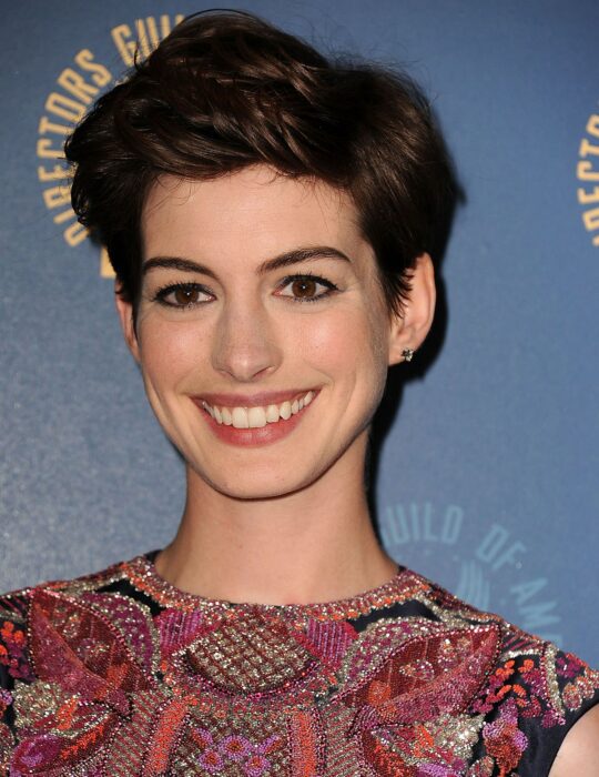 Anne Hathaway wearing a tousled pixi cut