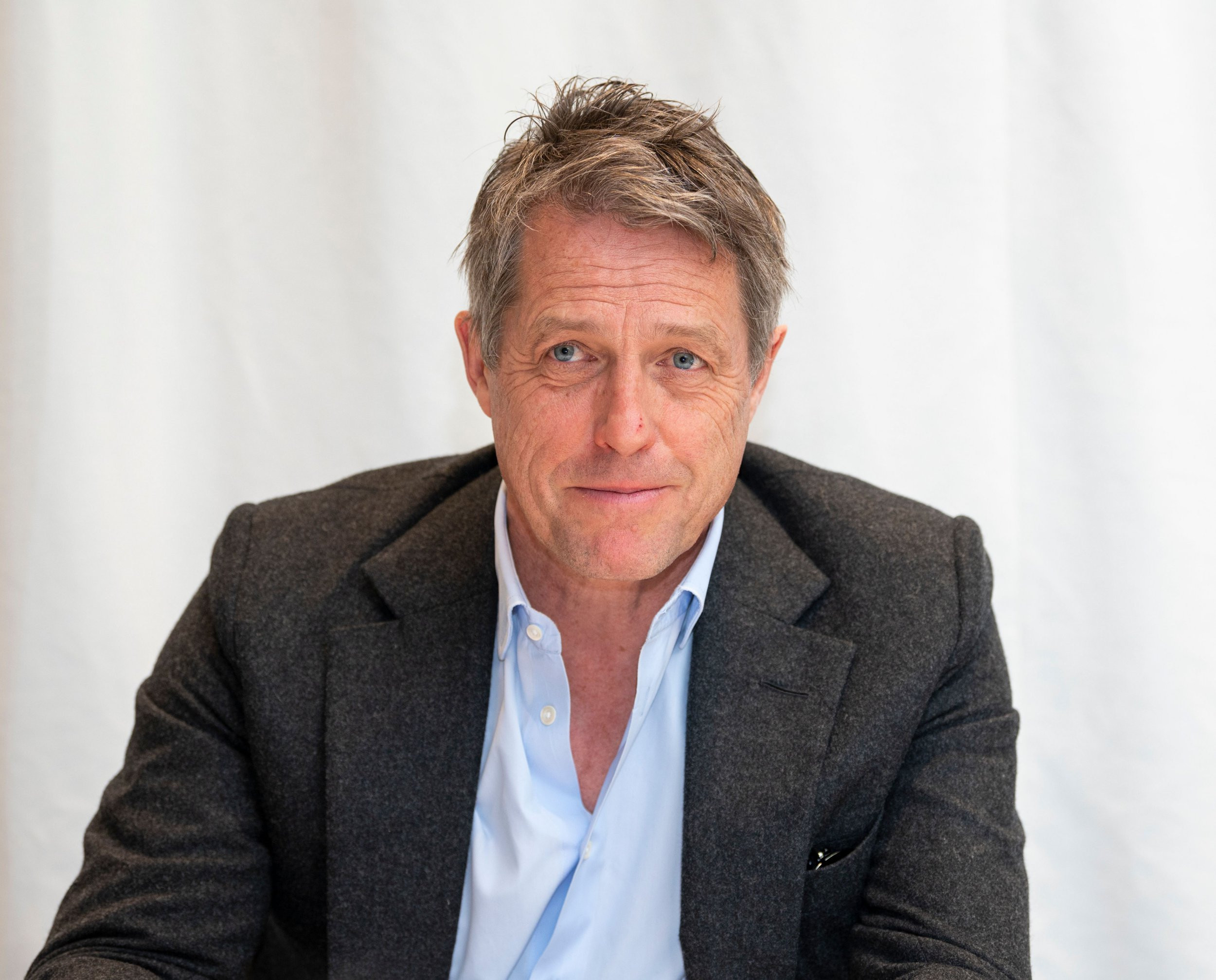 Hugh Grant; 17 Famous People Who Look Great on Gray Hair