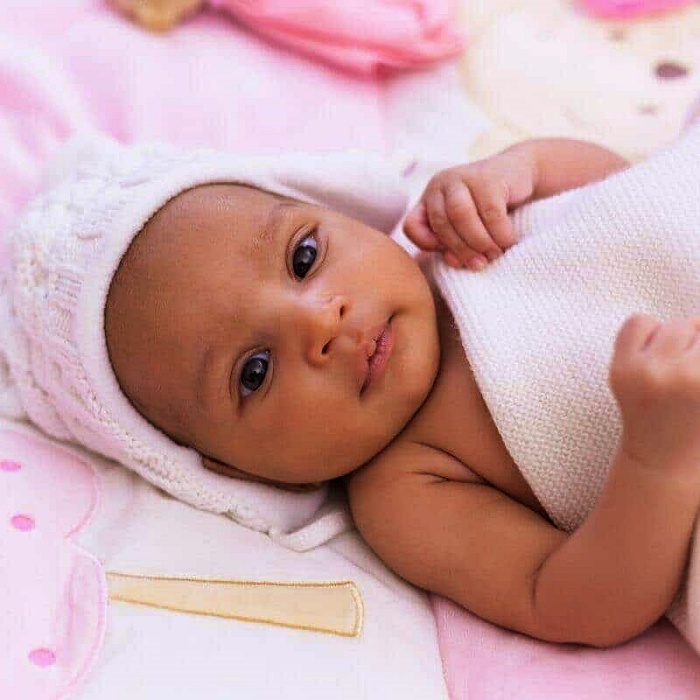 adorable baby girl with blonde, dark, brown hair