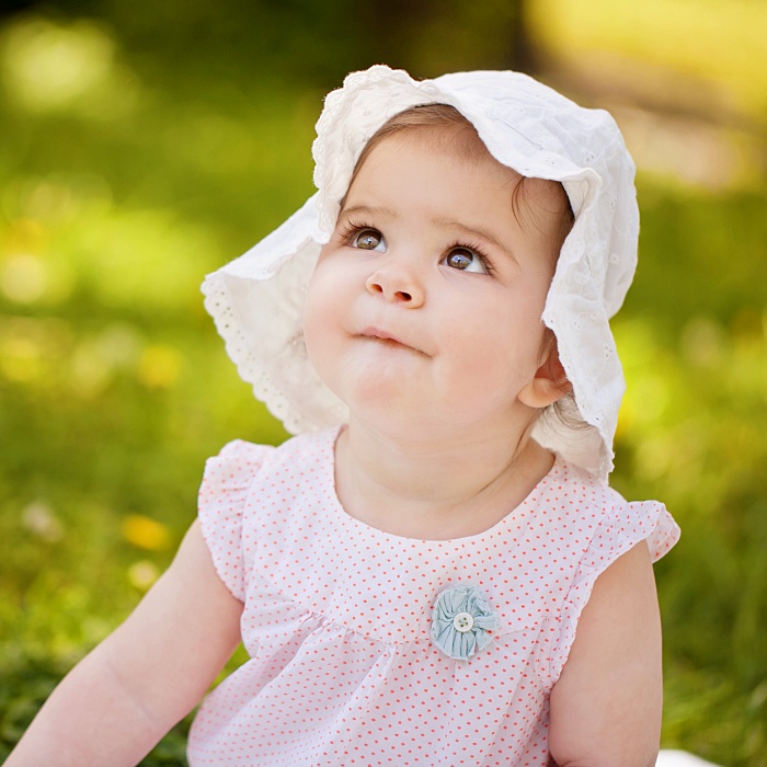 adorable baby girl with blonde, dark, brown hair