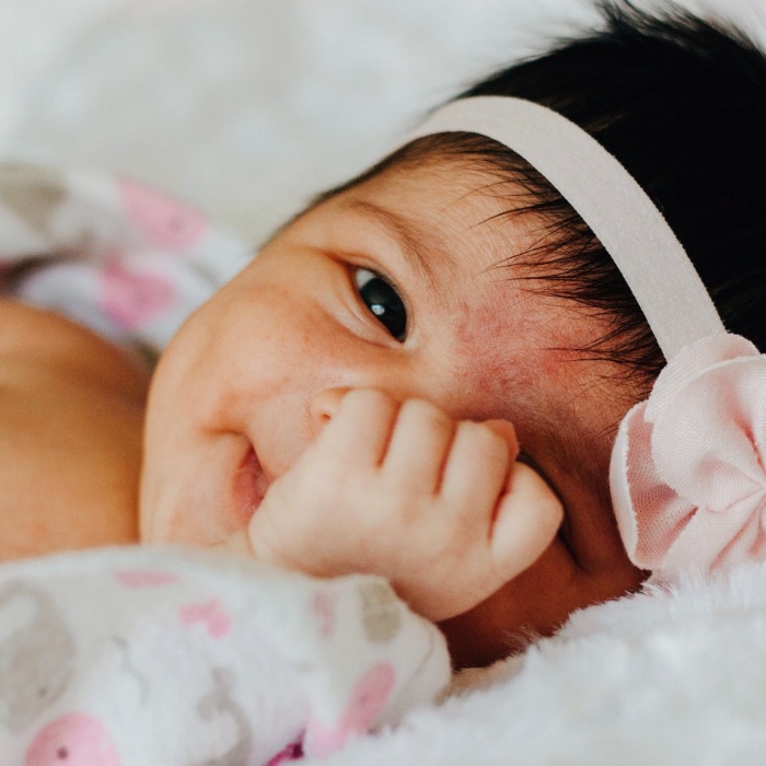 adorable baby girl with blonde, dark, brown hair