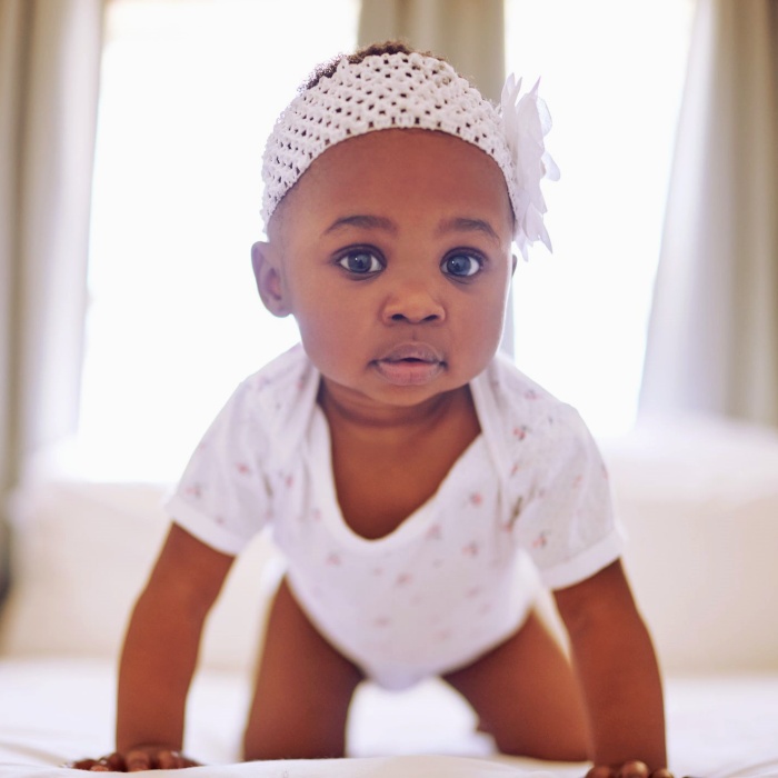 adorable baby girl with blonde, dark, brown hair