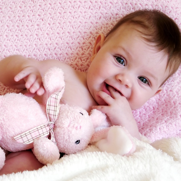 adorable baby girl with blonde, dark, brown hair