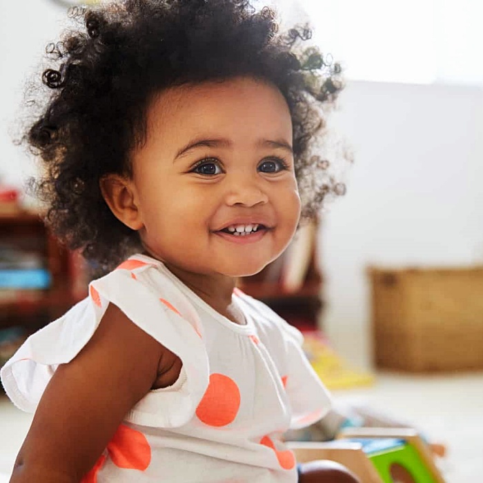 adorable baby girl with blonde, dark, brown hair