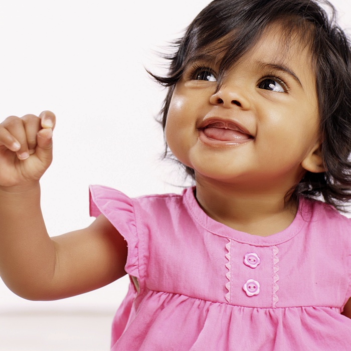 adorable baby girl with blonde, dark, brown hair