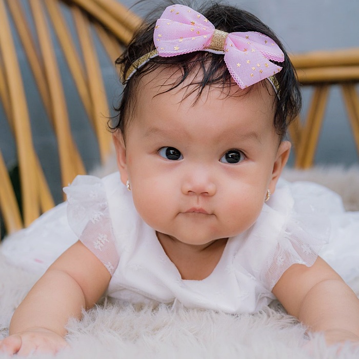 adorable baby girl with blonde, dark, brown hair