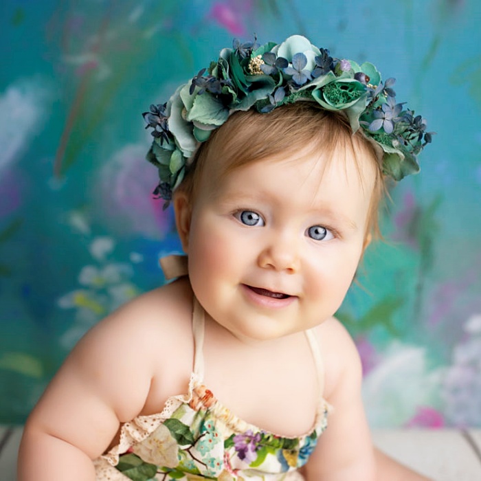 adorable baby girl with blonde, dark, brown hair