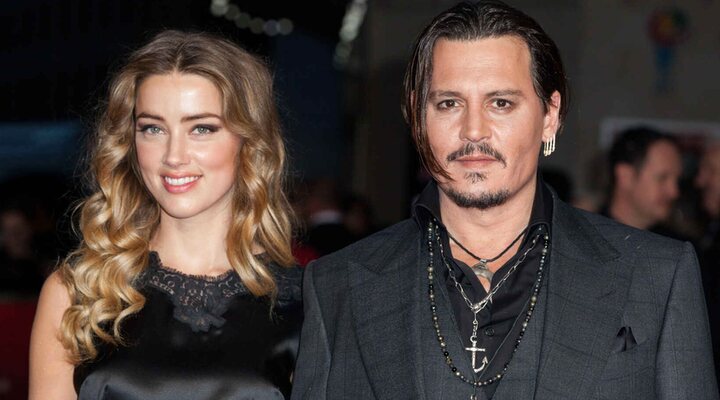 Johnny Depp y Amber Heard en una alfombra roja 