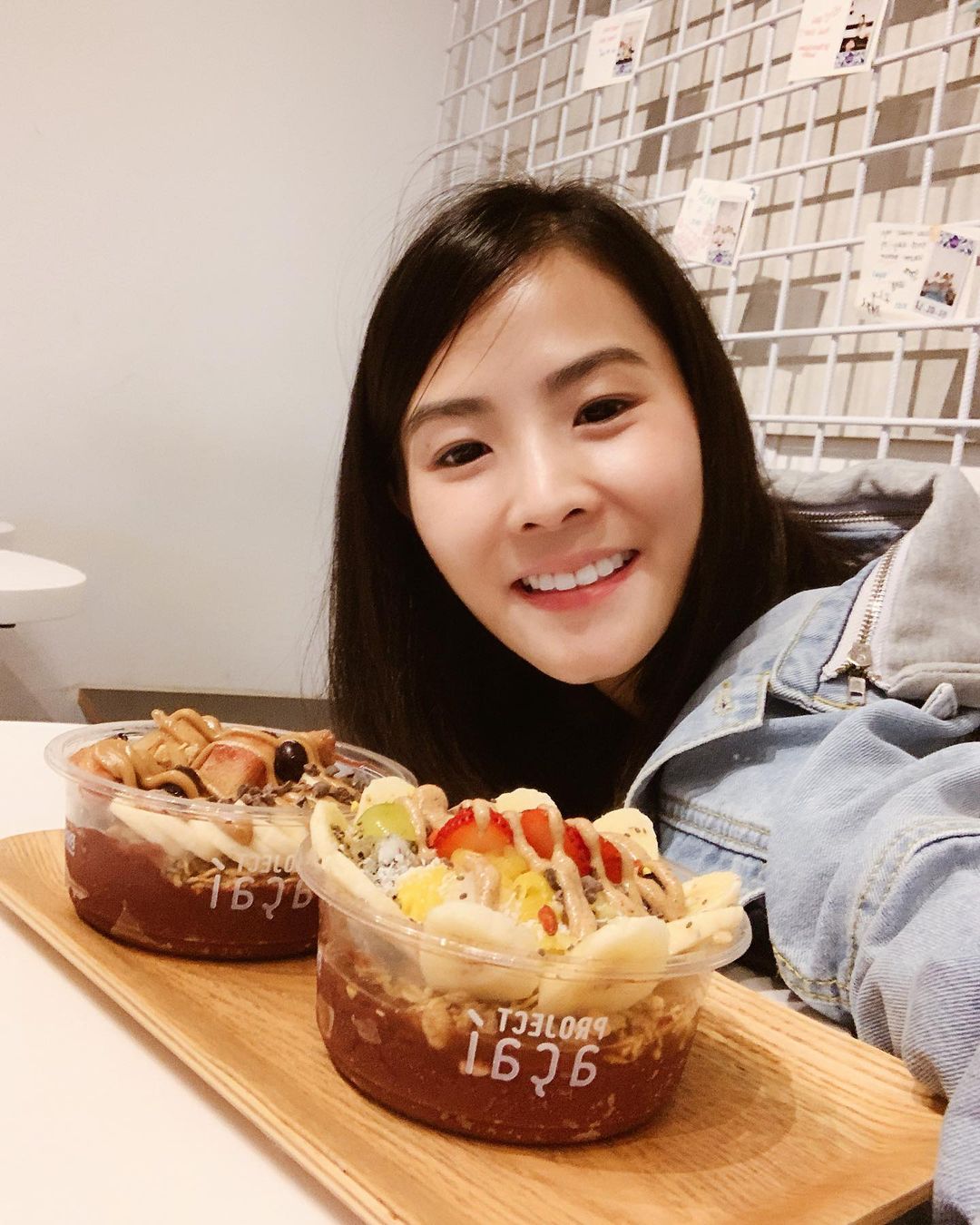 Girl in front of cakes;  Single mom quits her formal job to sell homemade bread and becomes an entrepreneur