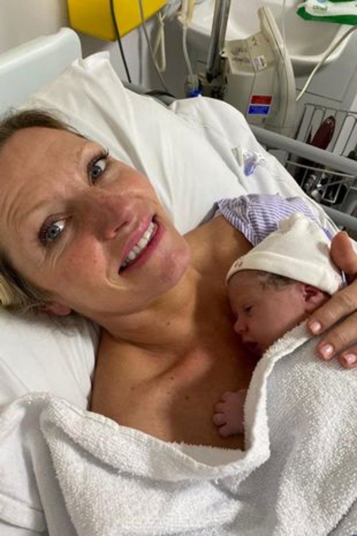 51-year-old woman showing the image of the birth of her baby