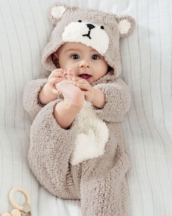 Baby lying in a crib sleeping