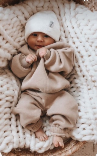 Baby lying in a crib sleeping