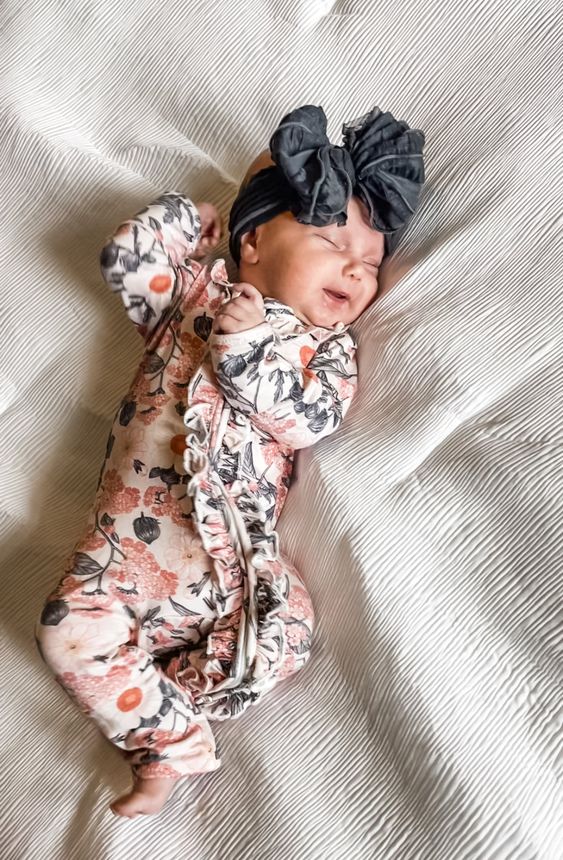 Baby lying in a crib sleeping