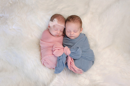 Babies lying in a crib sleeping