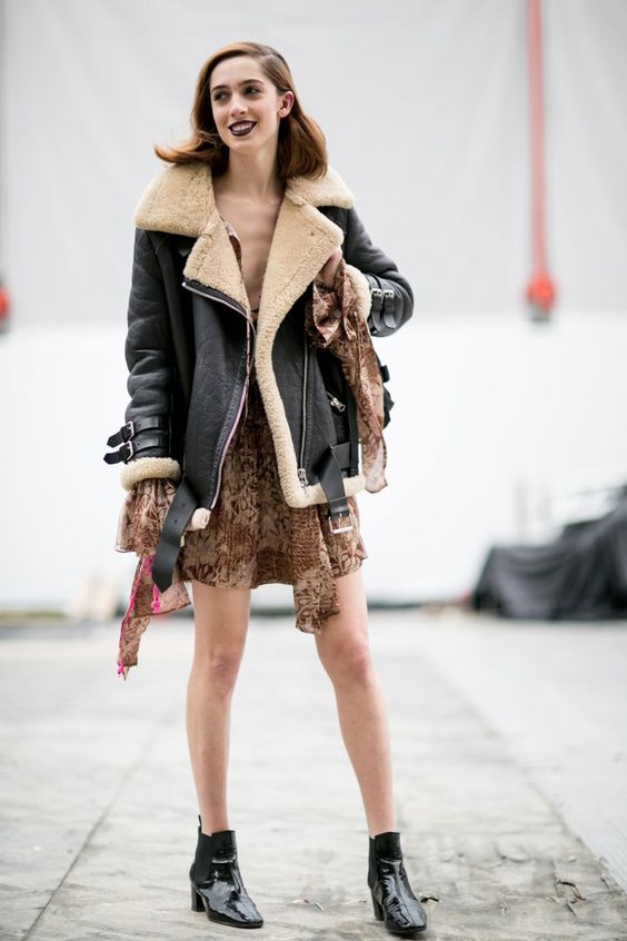 girl in dress; 15 Outfits with aviator jacket to keep you warm and fashionable