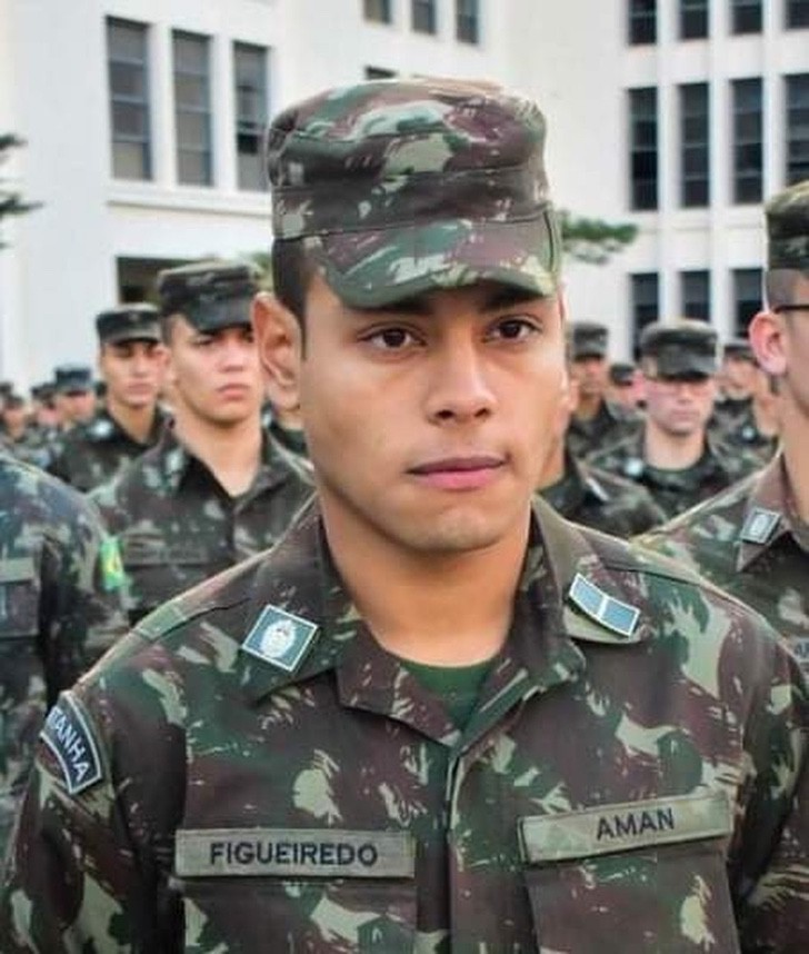 Soldier in military uniform;  Dad travels over 1,000 miles by bike to be at his son's graduation