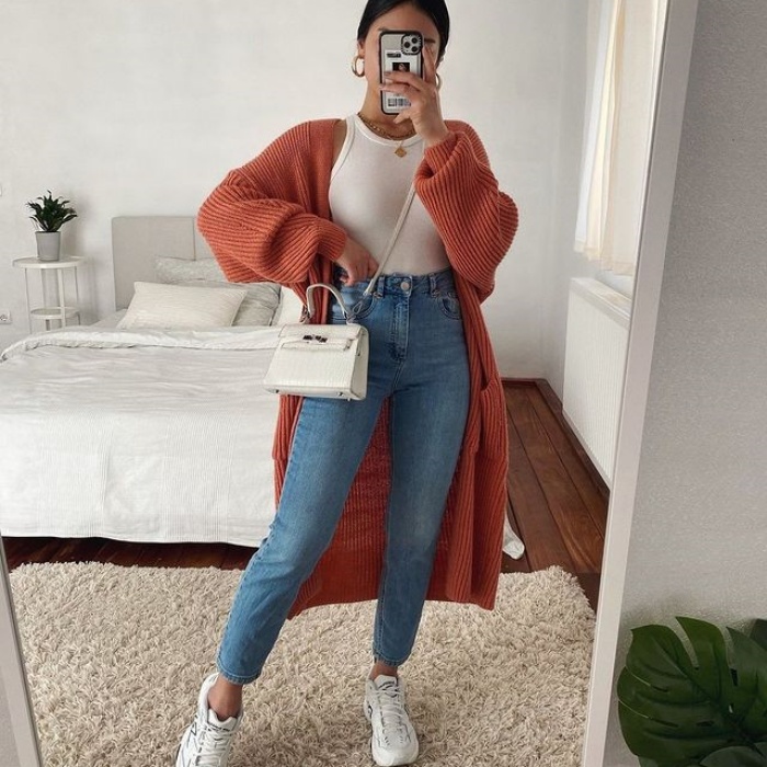 girl, girl, woman with short, long, brown, blond, light, dark hair wearing white tennis shoes, jeans, pants, sweatshirt, coat, oversized blouse, handbag, accessories, leather jacket