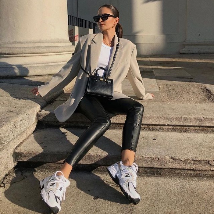 girl, girl, woman with short, long, brown, blond, light, dark hair wearing white tennis shoes, jeans, pants, sweatshirt, coat, oversized blouse, handbag, accessories, leather jacket