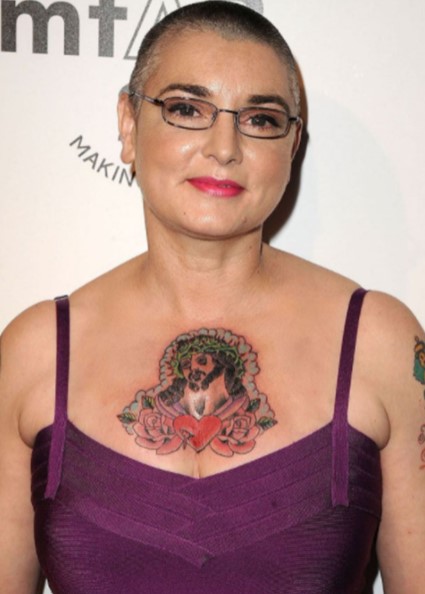 Sinéad O'Connor showing off her tattoo 