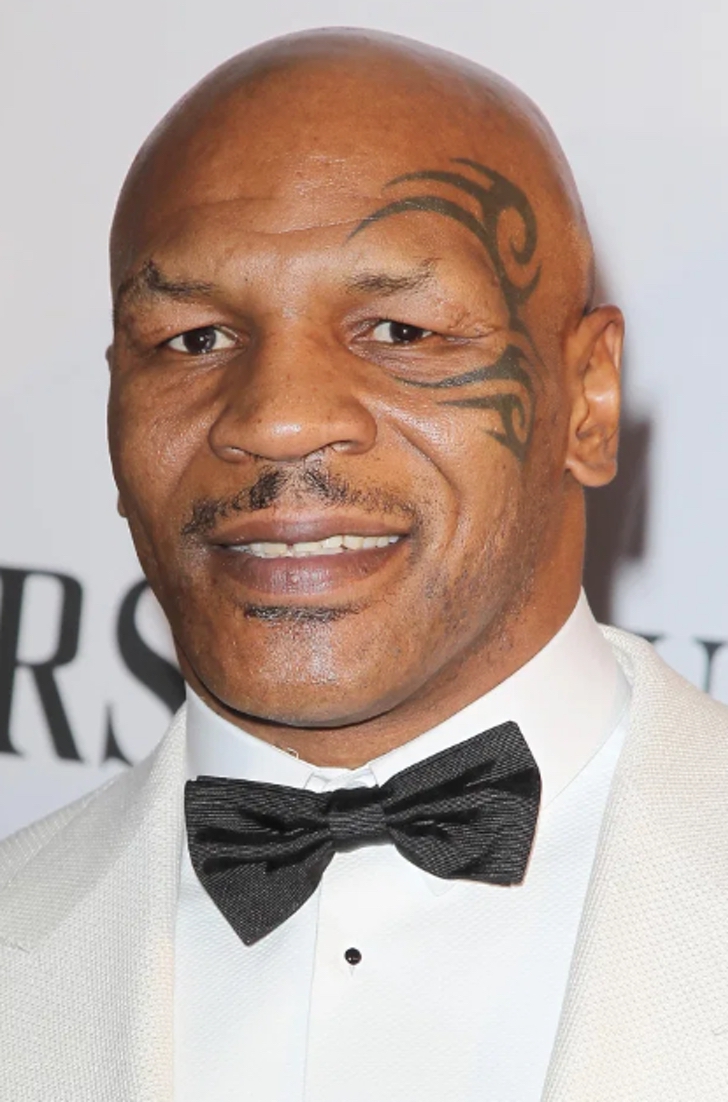 Mike Tyson showing his tattoo on his face