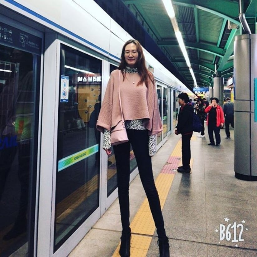 Renny the second girl with the longest legs in the world outside a train in Chicago