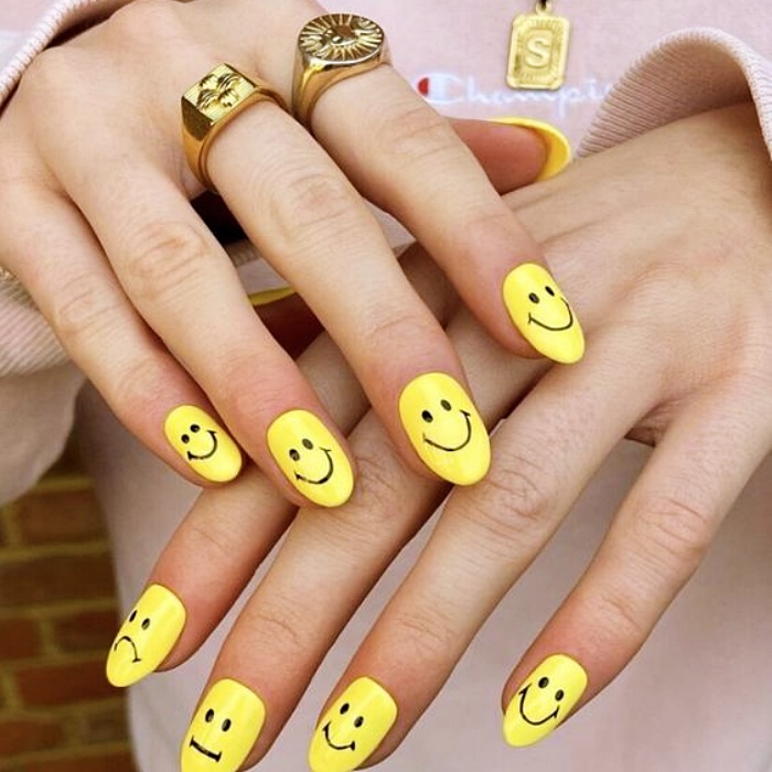 nail design with gelish, acrylics, false nails with happy faces, smiley face, in pink, blue, yellow, green and light blue