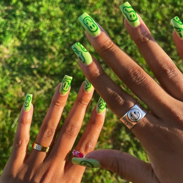 nail design with gelish, acrylics, false nails with happy faces, smiley face, in pink, blue, yellow, green and light blue