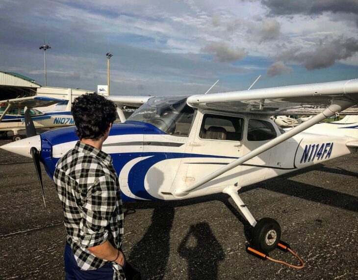 Lucas Jade Zumann next to his plane 