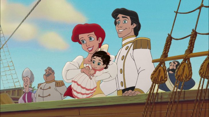 Scene from the little mermaid movie where she is carrying her daughter 