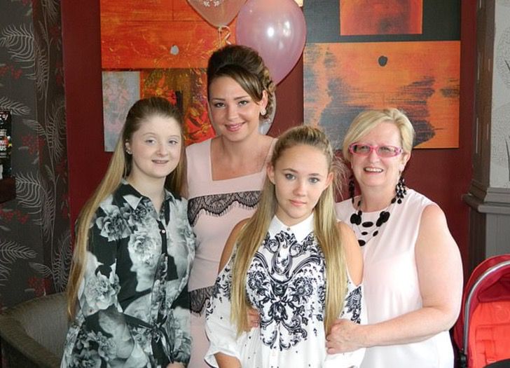 Photograph of a woman with her daughter and granddaughters 