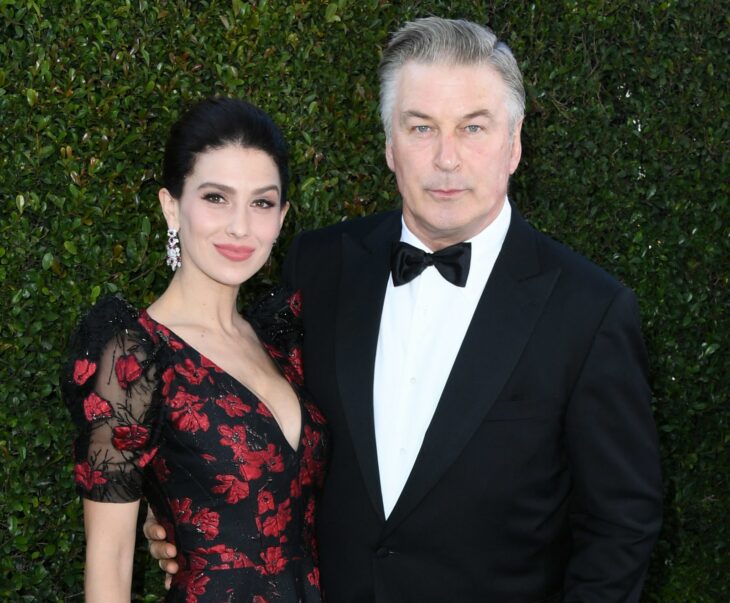 Alec Baldwin and Hilaria Baldwin together posing for a photo on a red carpet 