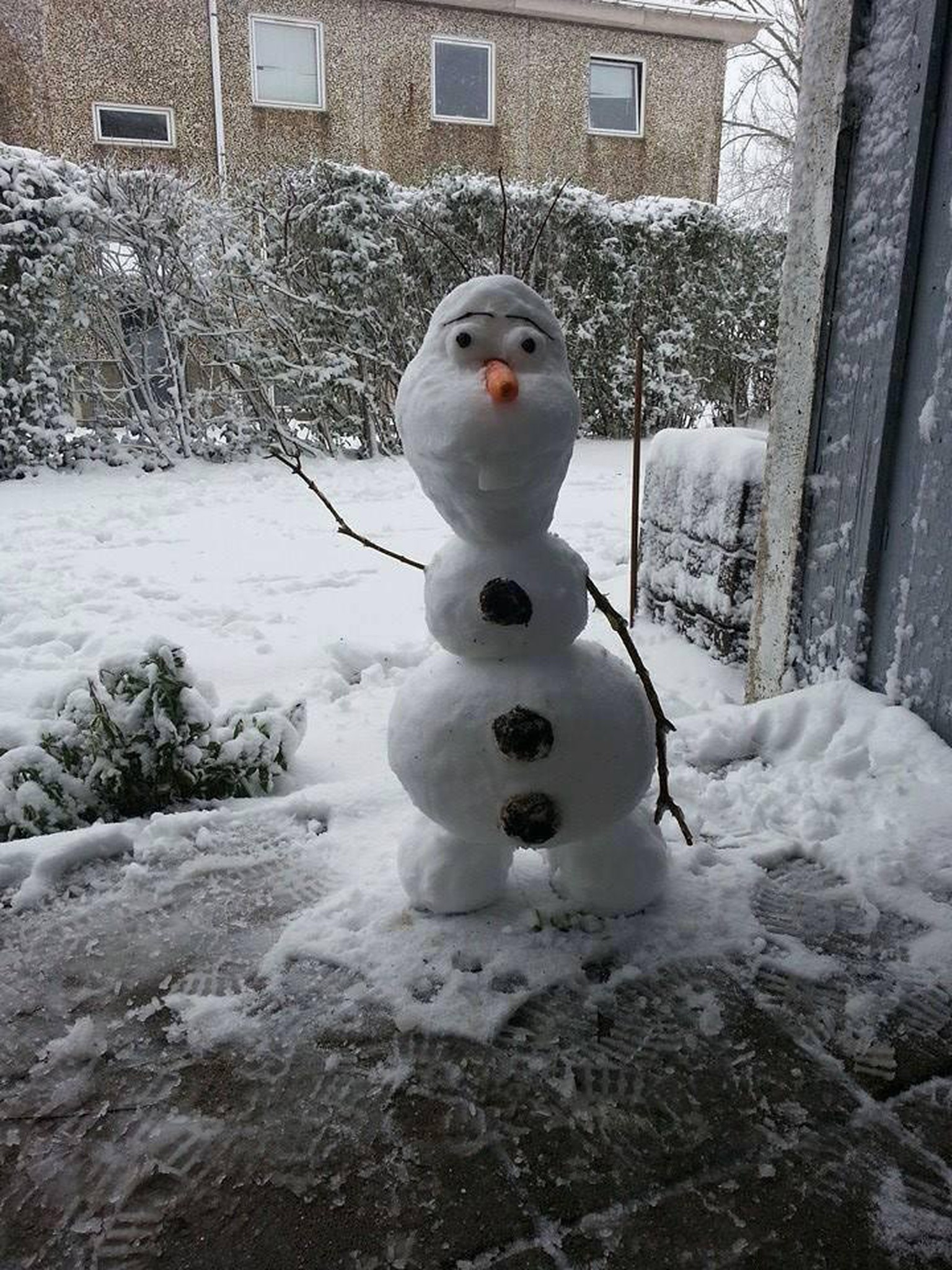 snow figure in the shape of Olaf the snowman from the movie Frozen