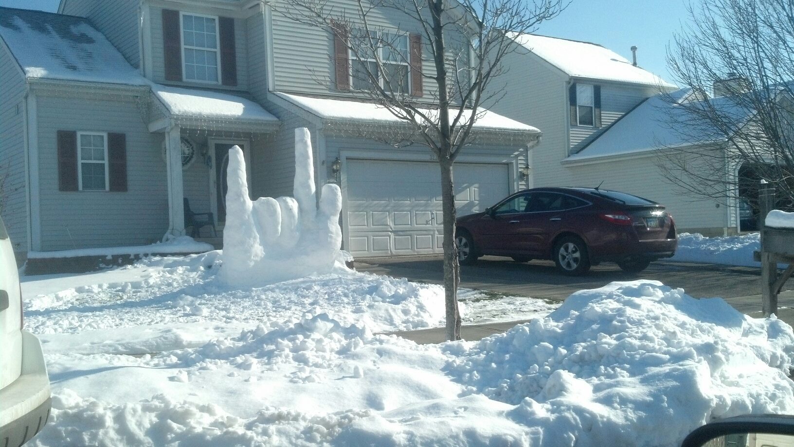 snow sculpture in the form of a hand making the Rock and Roll sign 