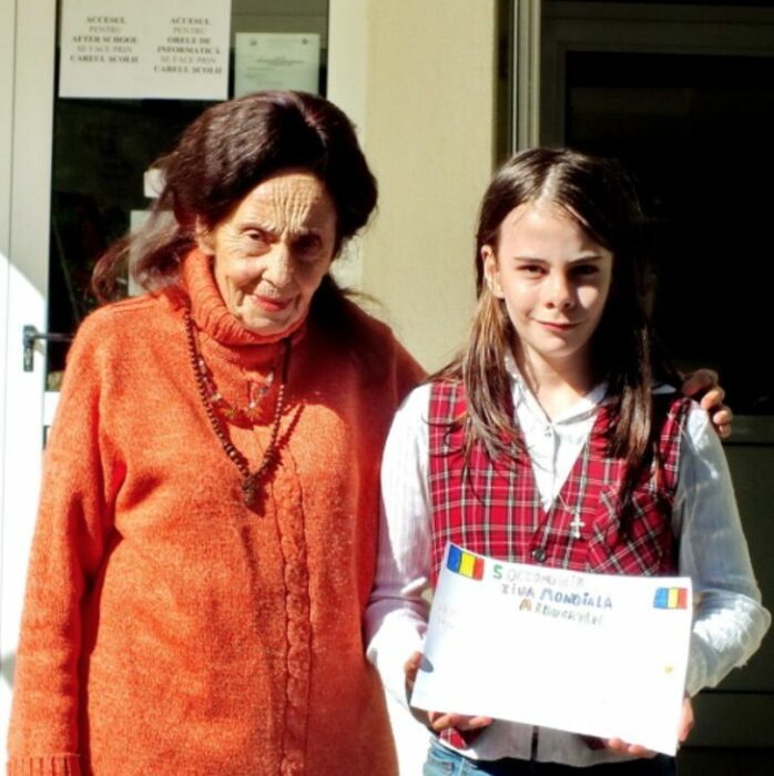 83-year-old woman with her daughter on her graduation day 