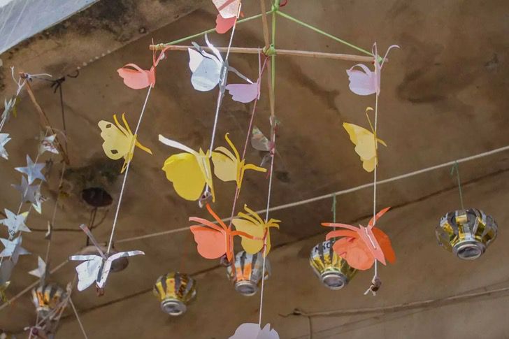 butterfly and flower shaped mobiles made from recyclable materials 