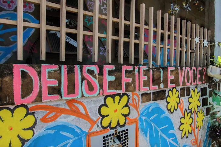 facade of a woman's house in Brazil with colorful flowers 