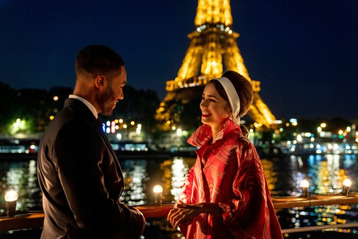 Emily scene in Paris with Alfie in front of the Eifel Tower 